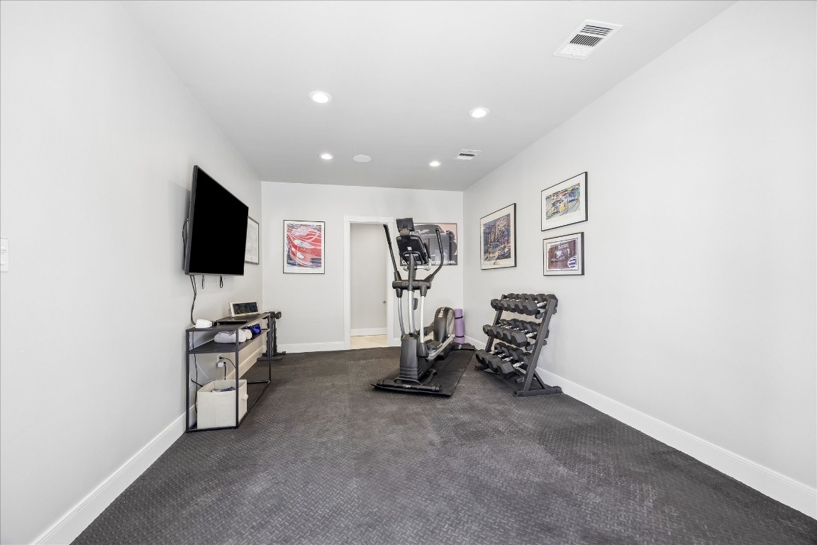 1741 Banks Street Houston, TX 77098 - Photo 28 of 31 a view of a livingroom with furniture and a flat screen tv