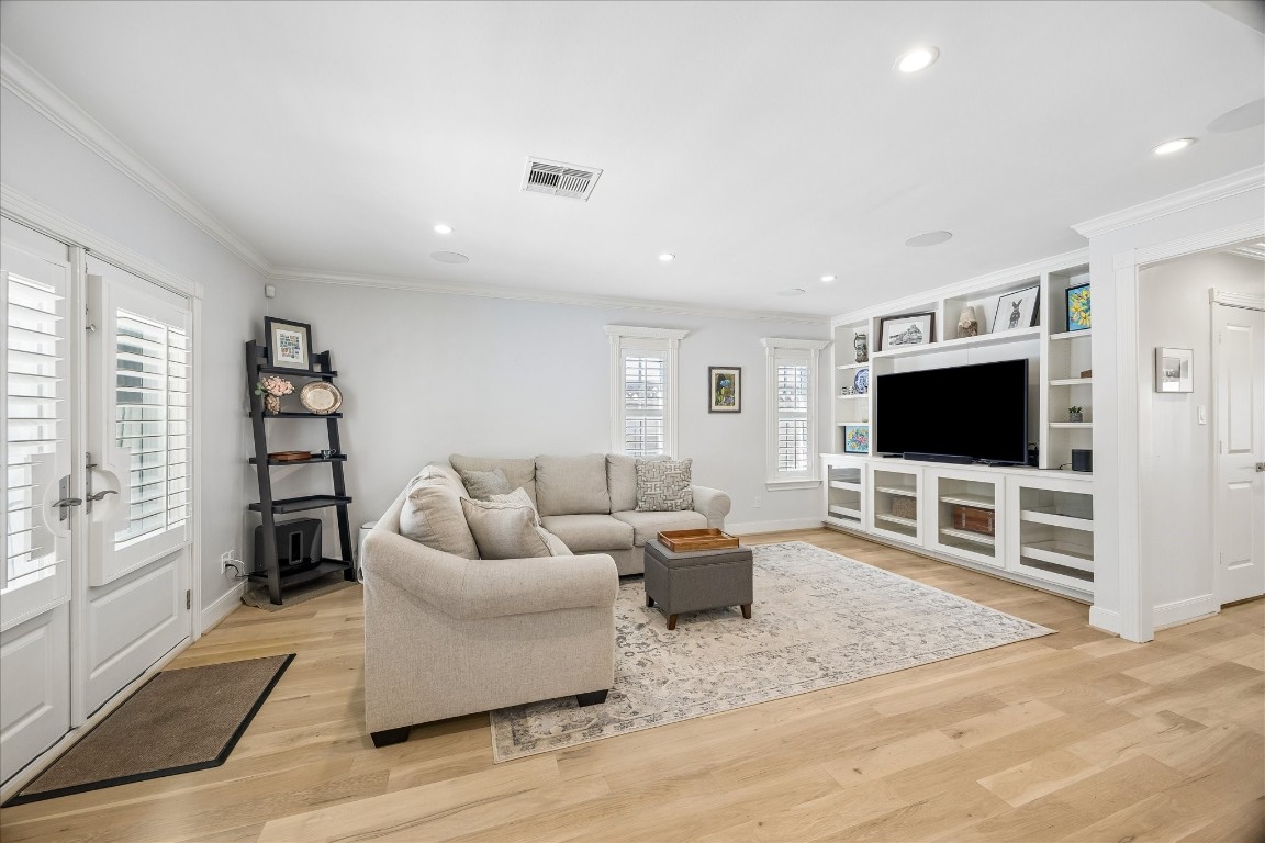 1741 Banks Street Houston, TX 77098 - Photo 9 of 31 a living room with furniture and a flat screen tv