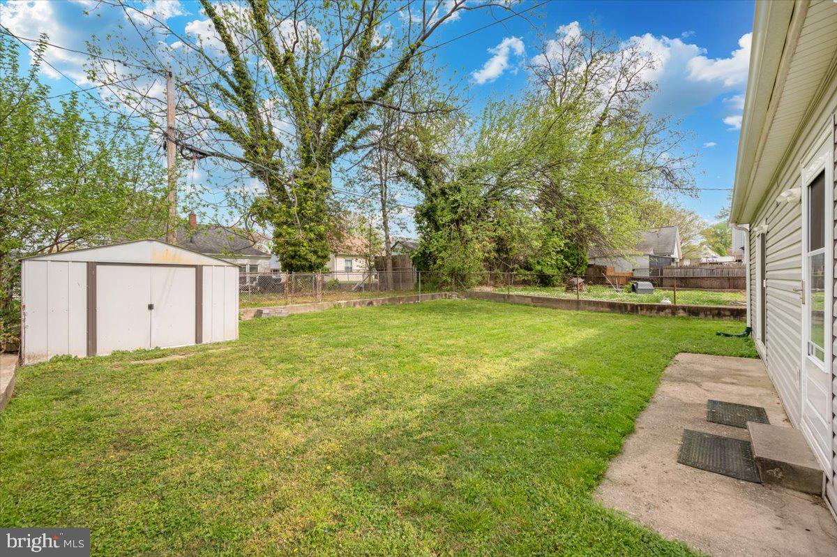 1910 Tyler Road Dundalk, MD 21222 - Photo 5 of 58 Spacious backyard with lush greenery.