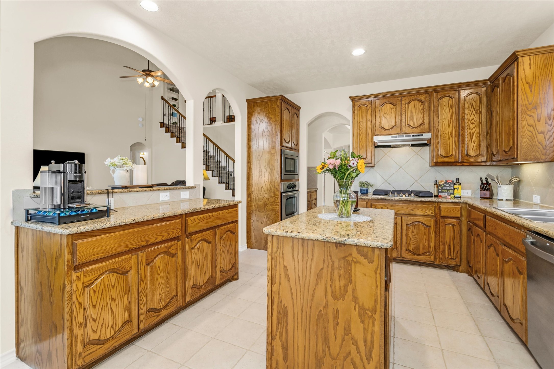 3211 Burton Ridge Drive Spring, TX 77386 - Photo 17 of 49 a kitchen with stainless steel appliances granite countertop a sink and cabinets