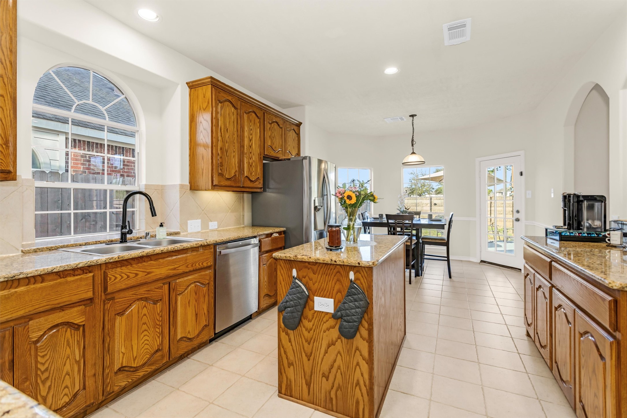 3211 Burton Ridge Drive Spring, TX 77386 - Photo 20 of 49 a large kitchen with kitchen island stainless steel appliances a sink and counter space