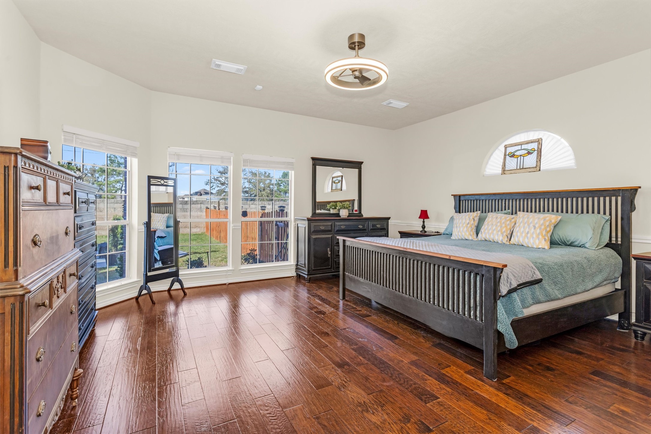 3211 Burton Ridge Drive Spring, TX 77386 - Photo 24 of 49 a bedroom with a bed and a flat tv screen on the dresser
