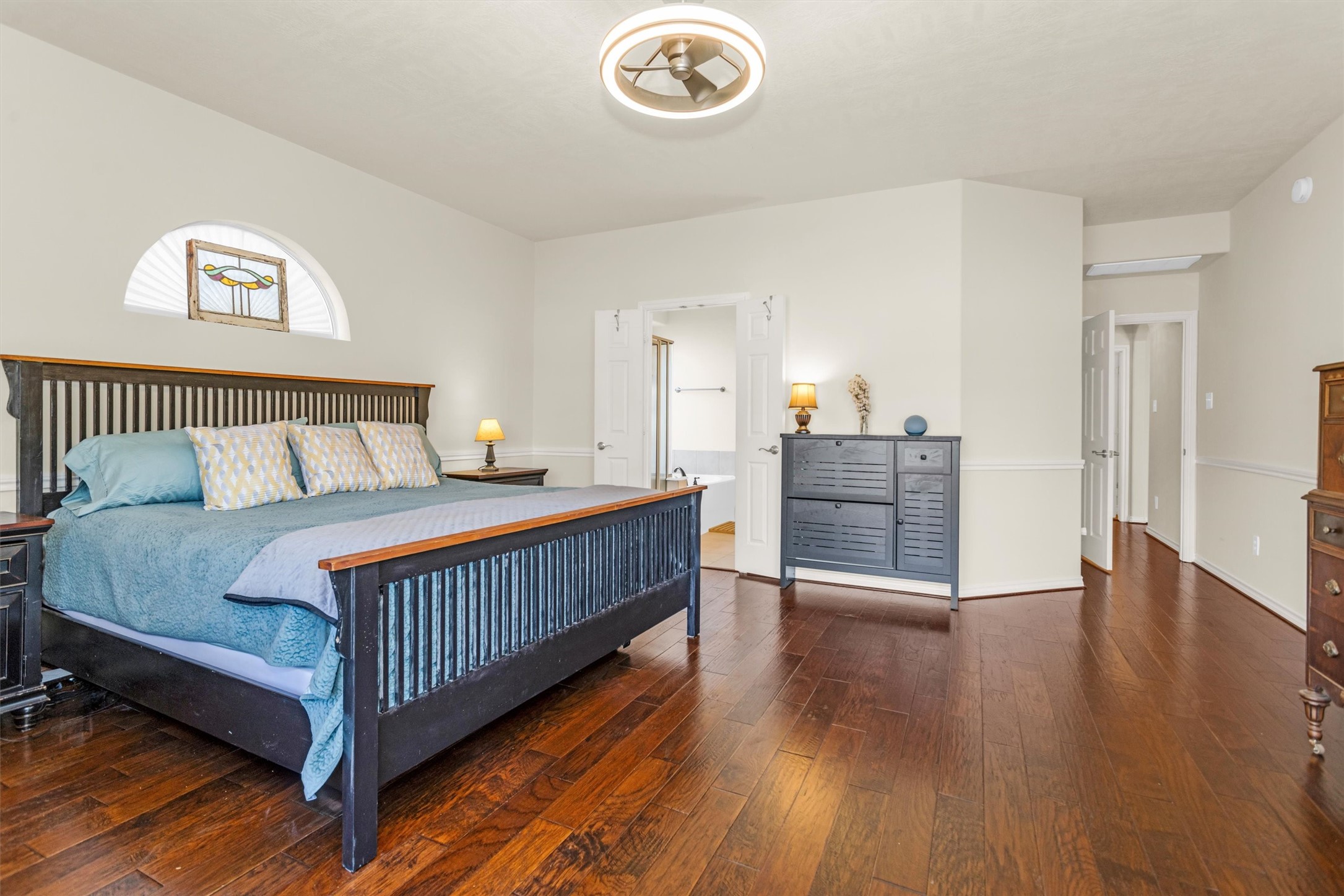 3211 Burton Ridge Drive Spring, TX 77386 - Photo 26 of 49 a bedroom with a bed and a table in it