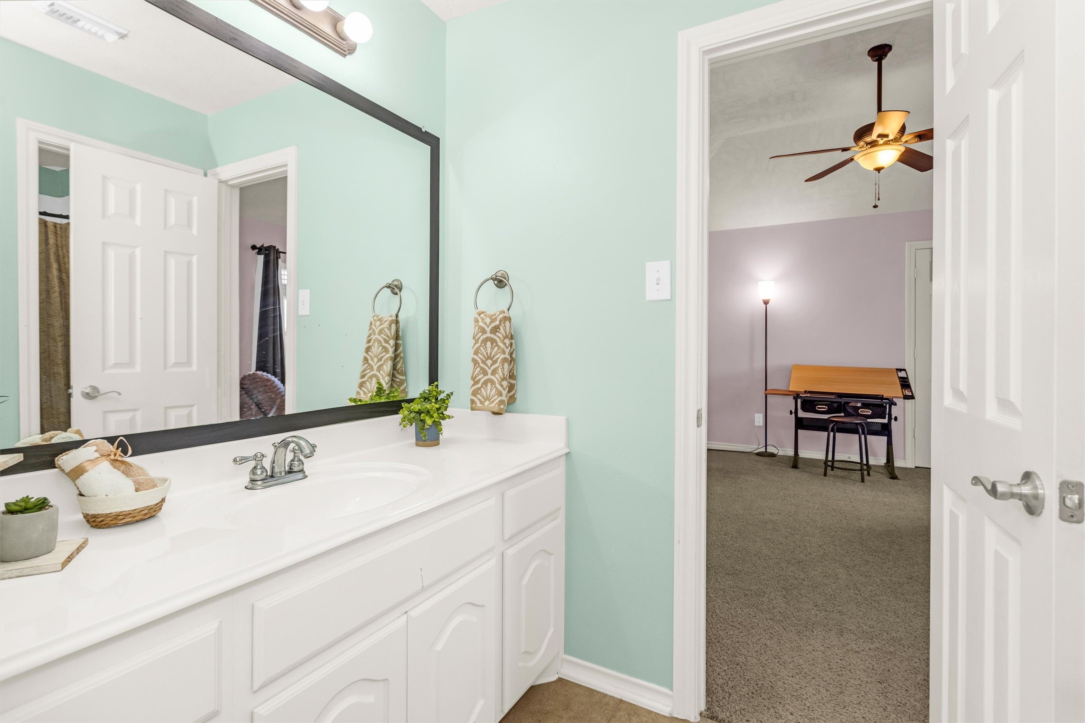 3211 Burton Ridge Drive Spring, TX 77386 - Photo 41 of 49 a en suite bathroom with a sink and a mirror