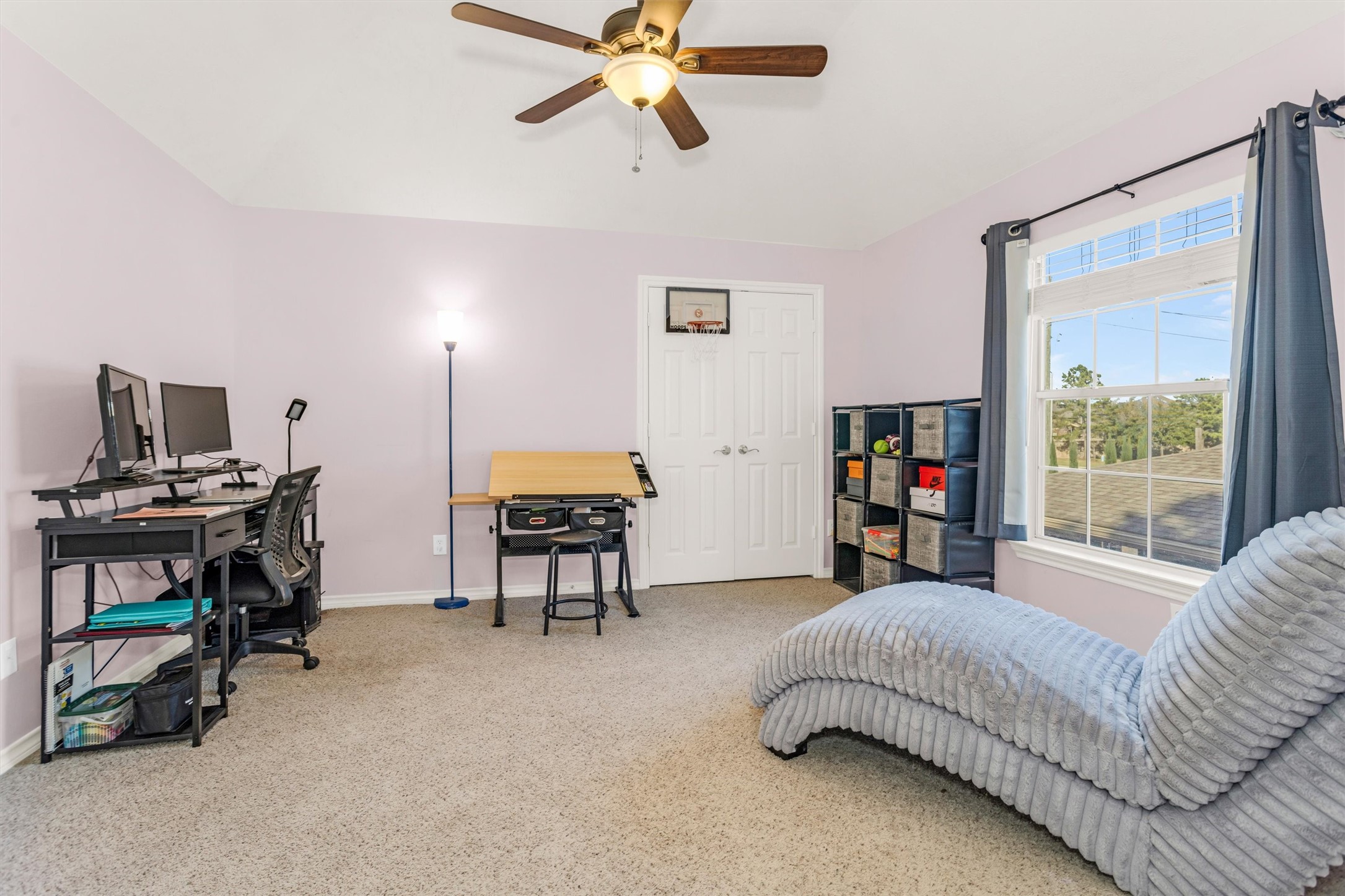 3211 Burton Ridge Drive Spring, TX 77386 - Photo 42 of 49 a bedroom with furniture and a window