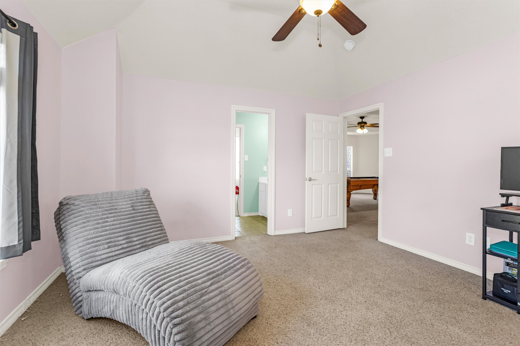 3211 Burton Ridge Drive Spring, TX 77386 - Photo 43 of 49 a bedroom with a bed and ceiling fan