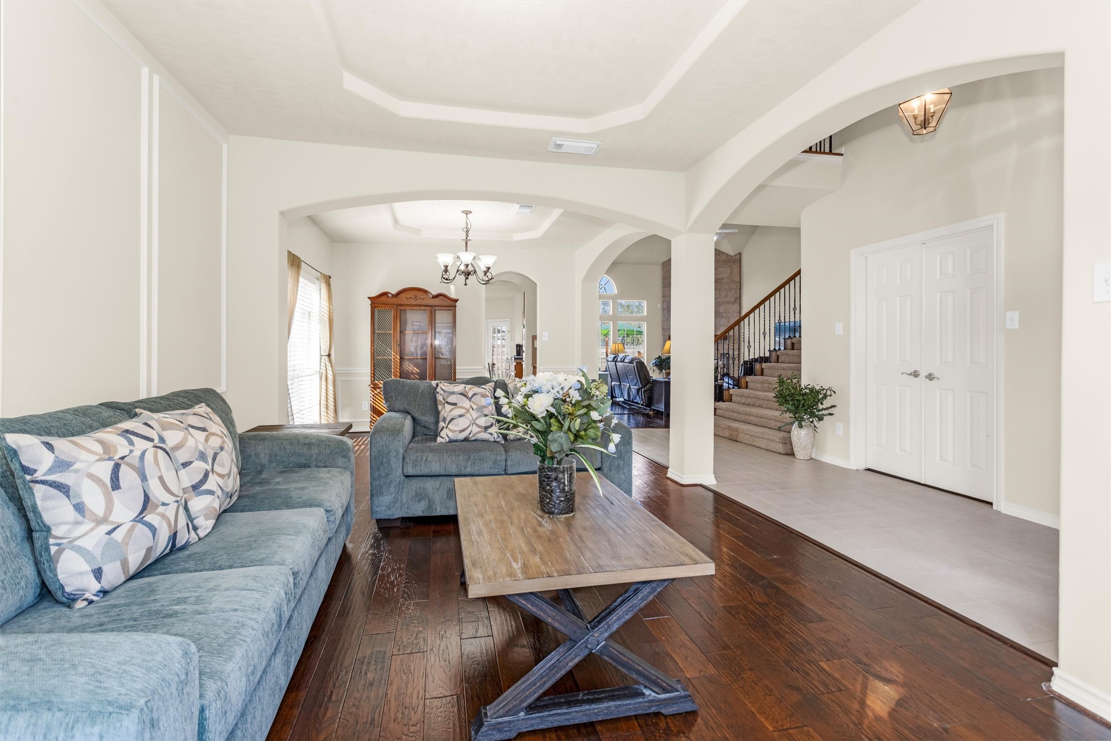3211 Burton Ridge Drive Spring, TX 77386 - Photo 7 of 49 a living room with furniture potted plant and a chandelier
