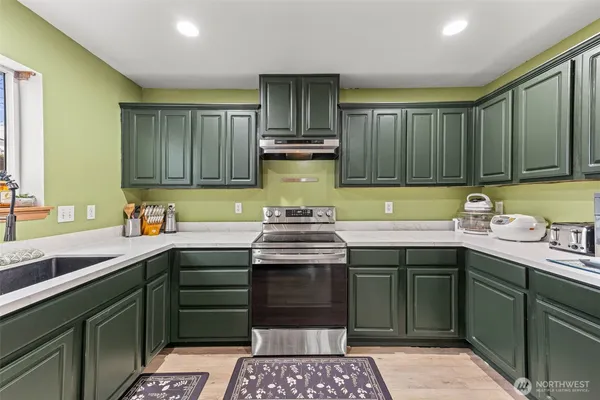a kitchen with a sink and cabinets