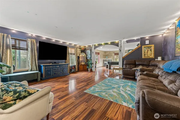 a living room with furniture and a flat screen tv