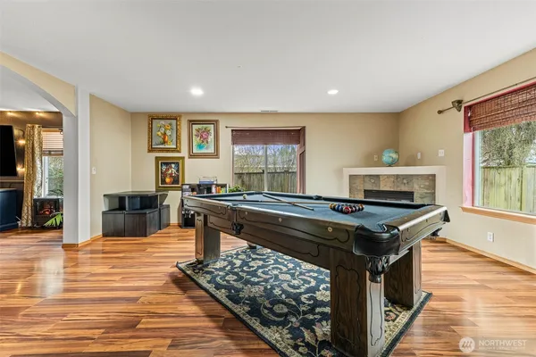 a kitchen with stainless steel appliances granite countertop a stove and a wooden cabinets