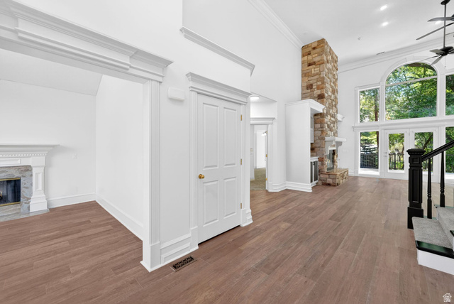 883 East 700 South Springville, UT 84663 - Photo 5 of 59 Vaulted living space featuring a stone-clad fireplace and expansive window wall