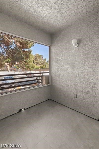 3320 South Fort Apache Road, Unit 125 Las Vegas, NV 89117 - Photo 23 of 26 A window-lined room offers a tranquil view of the neighborhood trees.