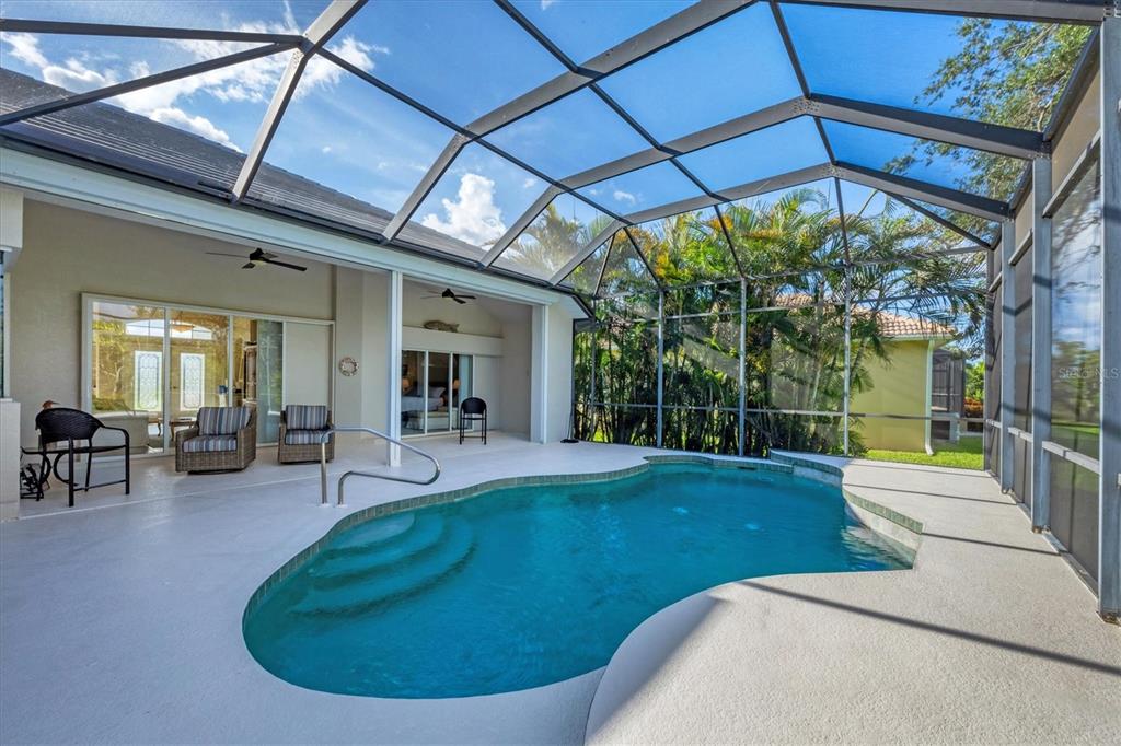 4 Windward Way Placida, FL 33946 - Photo 23 of 39 a view of a swimming pool with a patio