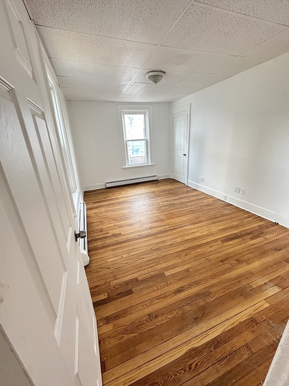 391 Pleasant Street Holyoke, MA 01040 - Photo 7 of 14 a view of empty room with window