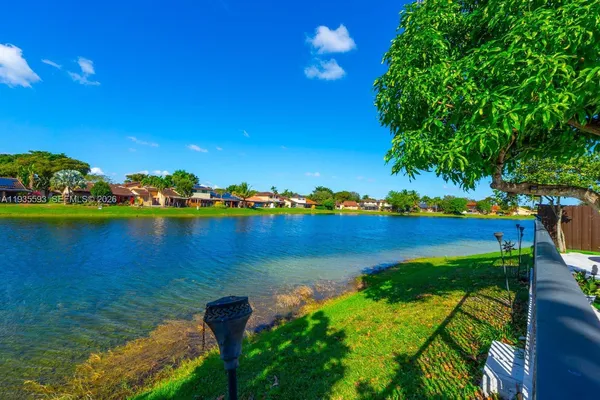 a view of a lake with a big yard