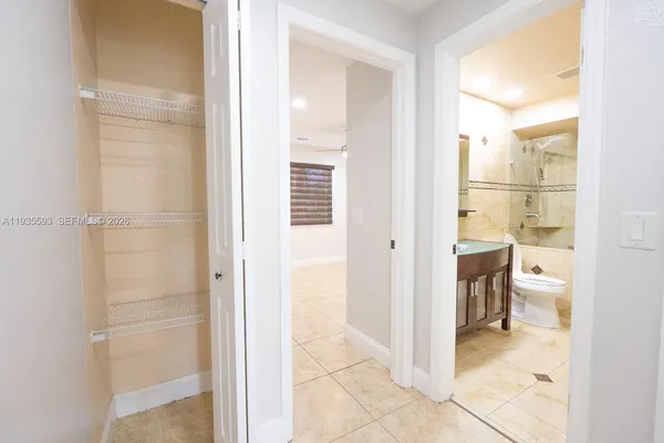 a view of a bathroom from a hallway