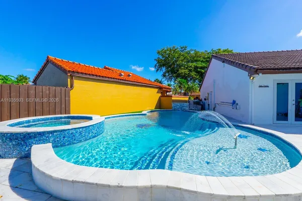 a view of a swimming pool with a patio