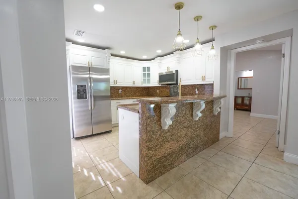 a bathroom with a shower and a sink