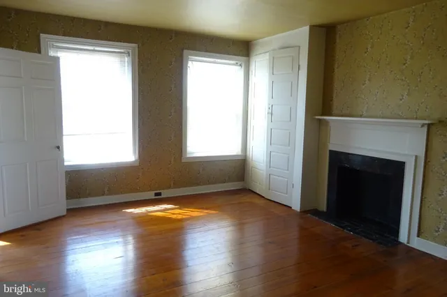 a view of an empty room with a window