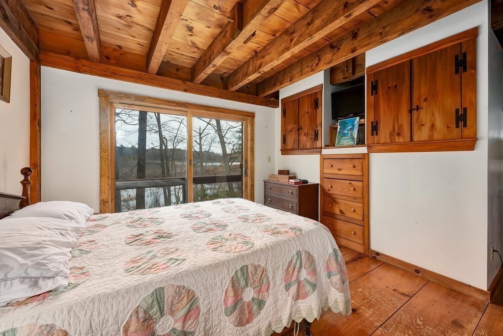 357 Ipswich Road Boxford, MA 01921 - Photo 12 of 28 a bedroom with a bed and a large window with the outer view