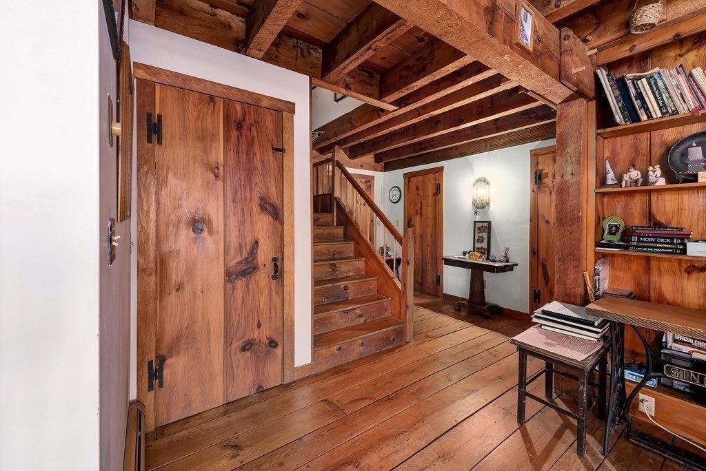 357 Ipswich Road Boxford, MA 01921 - Photo 14 of 28 a view of a hallway with wooden floor and staircase