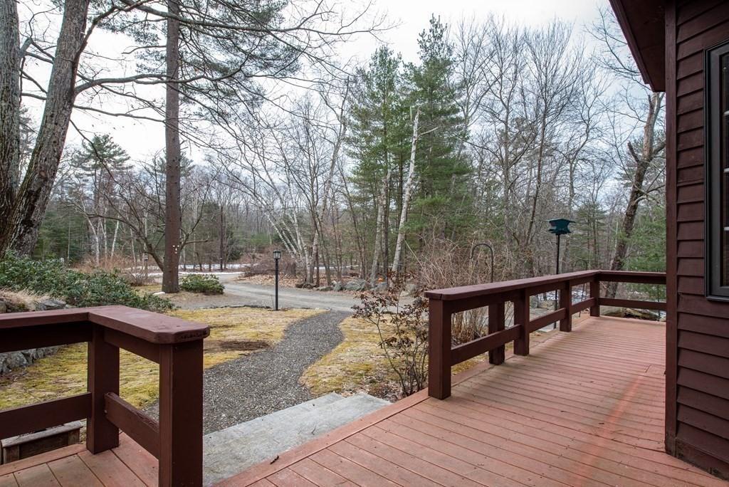 357 Ipswich Road Boxford, MA 01921 - Photo 2 of 28 a view of a wooden deck with chairs and a yard