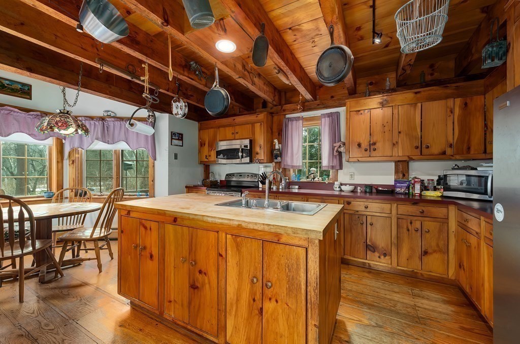 357 Ipswich Road Boxford, MA 01921 - Photo 7 of 28 a view of a kitchen with a large window