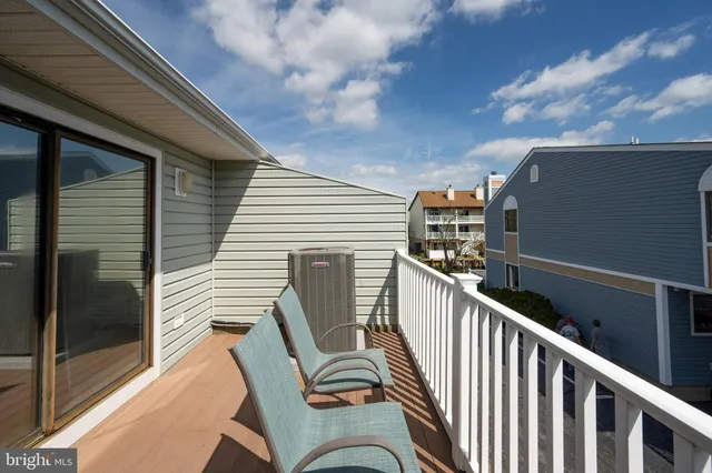 a view of a balcony with furniture
