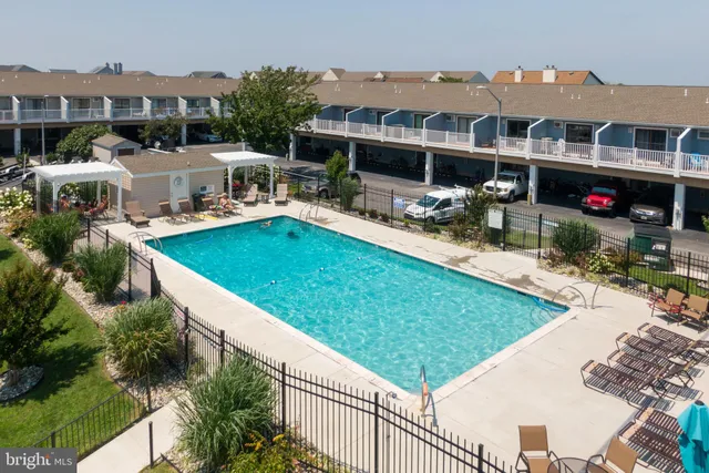 a view of a house with pool porch and sitting area
