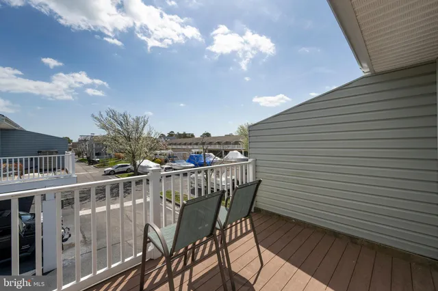 a view of a balcony with furniture