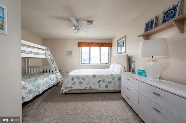 a bedroom with bed and window