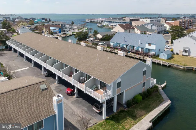 an aerial view of a house with a ocean view