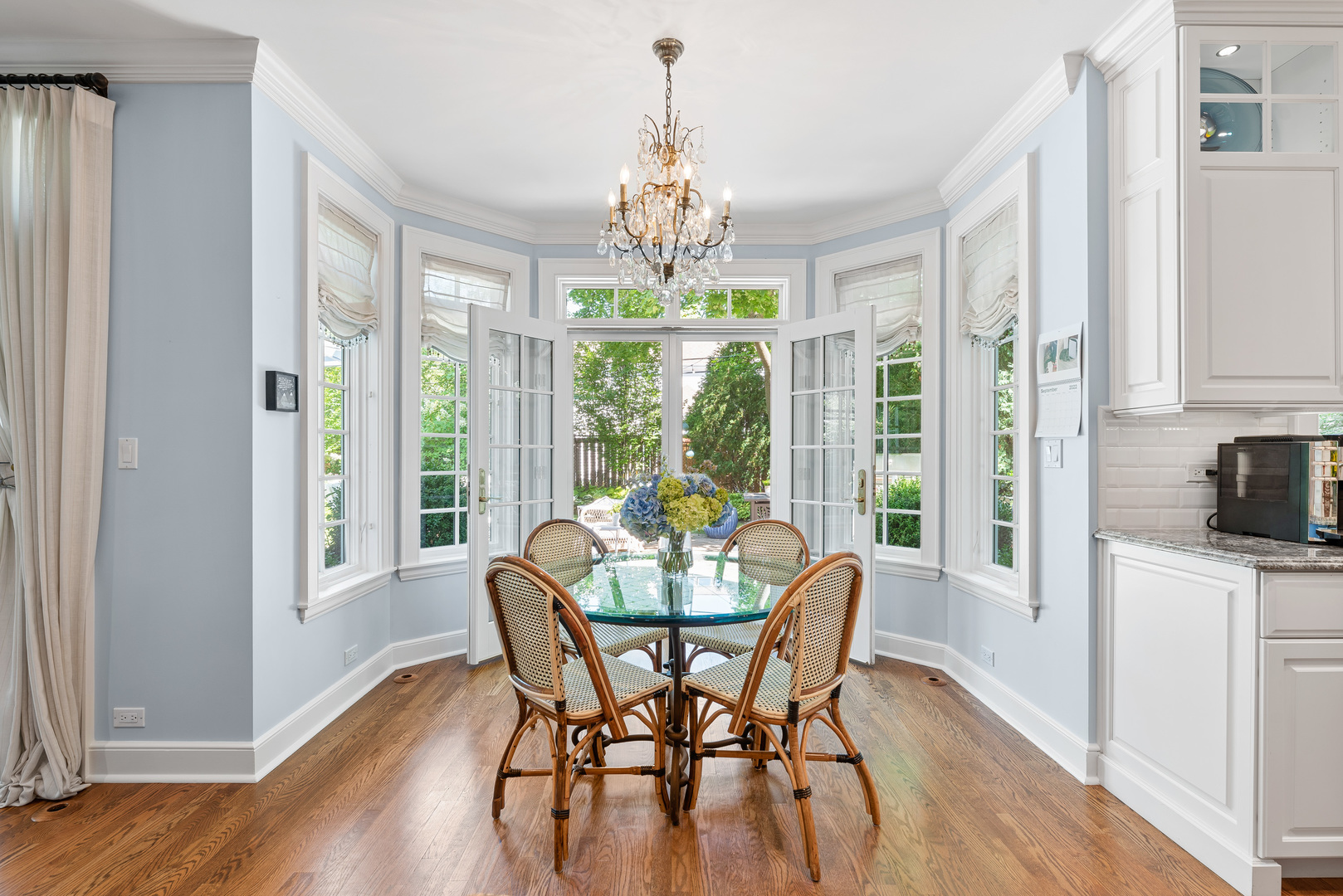 611 County Line Road Highland Park, IL 60035 - Photo 19 of 49 a view of a dining room with furniture wooden floor and chandelier
