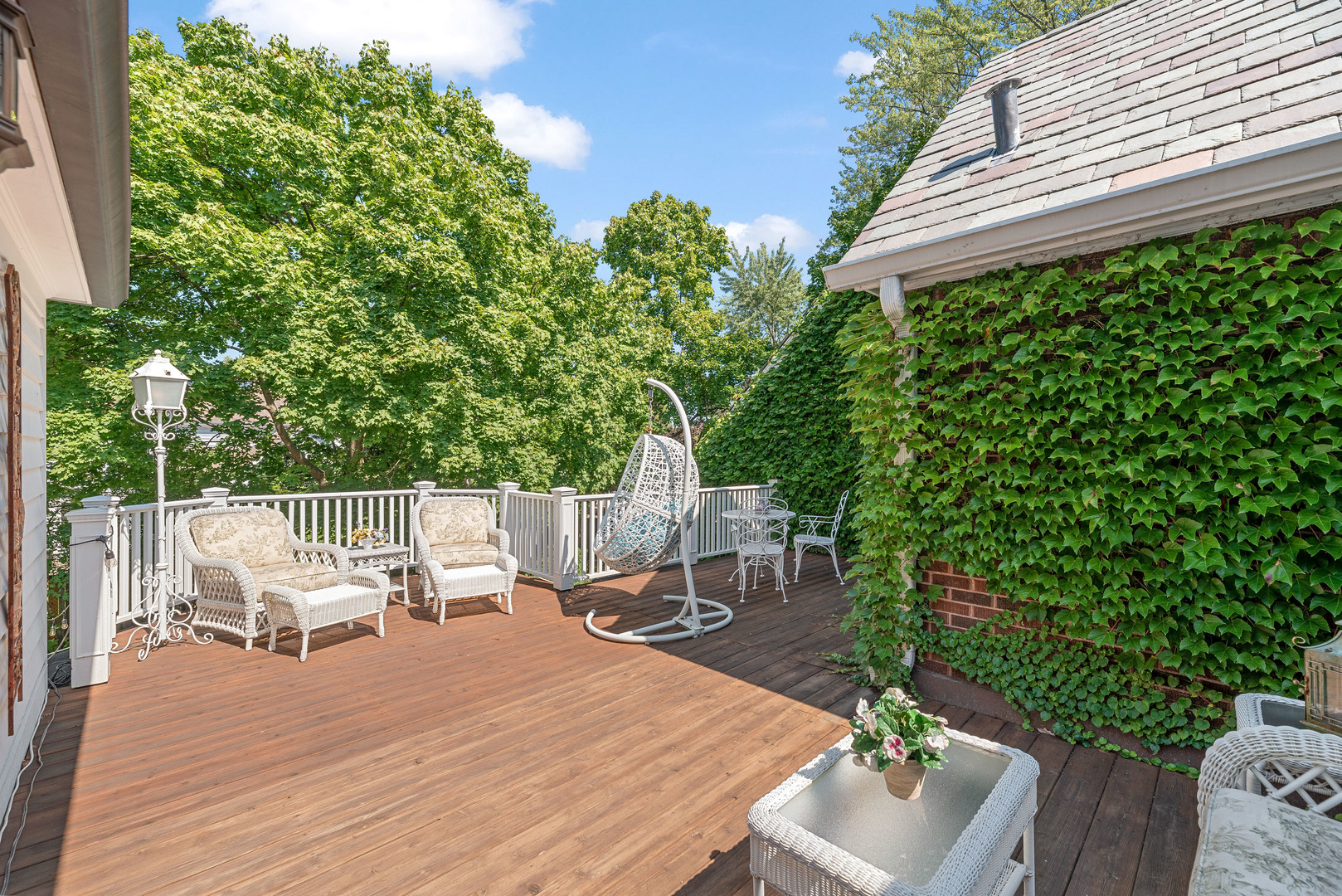 611 County Line Road Highland Park, IL 60035 - Photo 31 of 49 a view of backyard with a table and chairs and potted plants