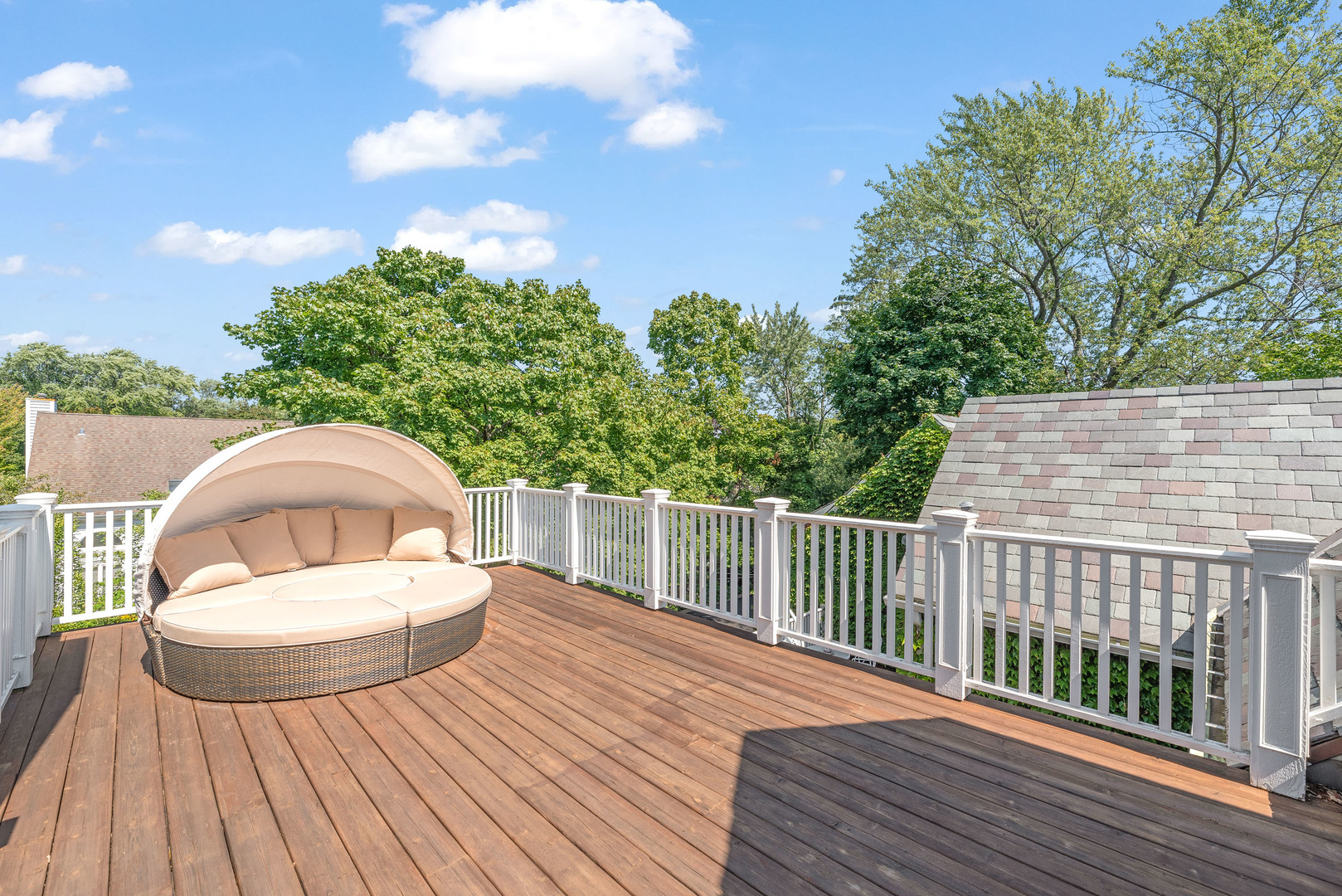 611 County Line Road Highland Park, IL 60035 - Photo 42 of 49 a view of a roof deck with wooden floor and fence