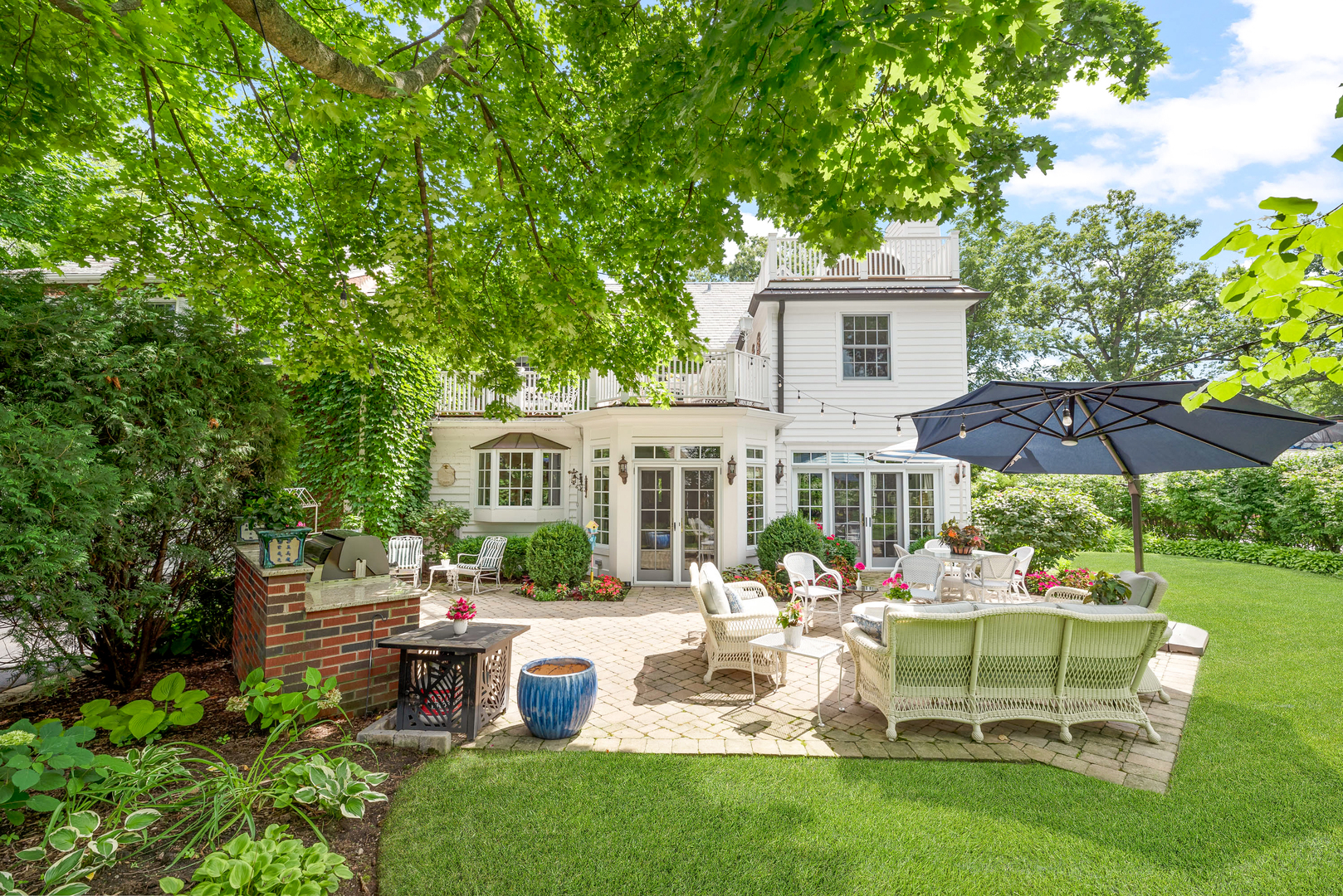 611 County Line Road Highland Park, IL 60035 - Photo 44 of 49 a view of a house with backyard sitting area and garden