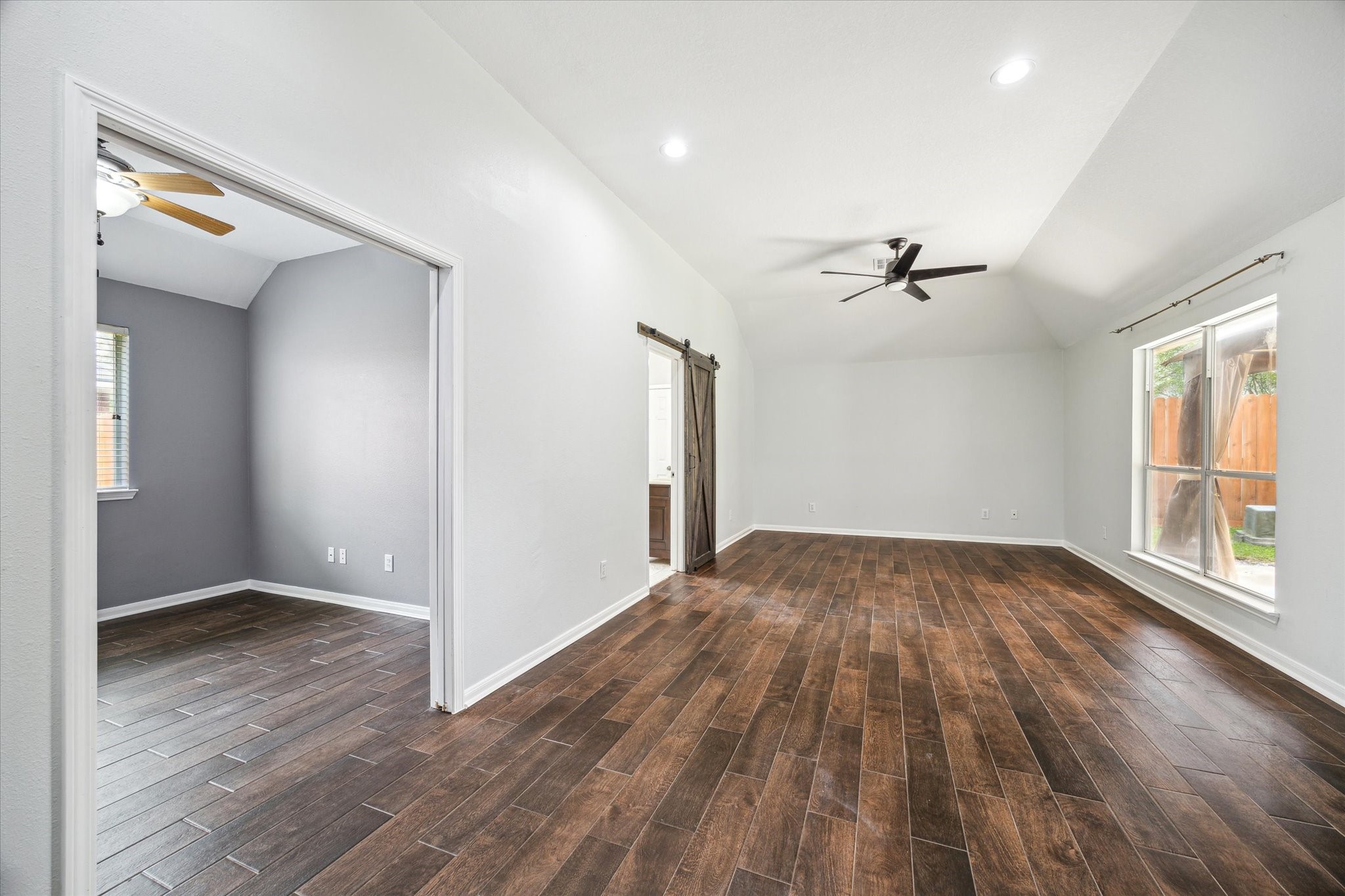 20910 Sandy Briar Court Spring, TX 77379 - Photo 16 of 28 wooden floor in an empty room with a window