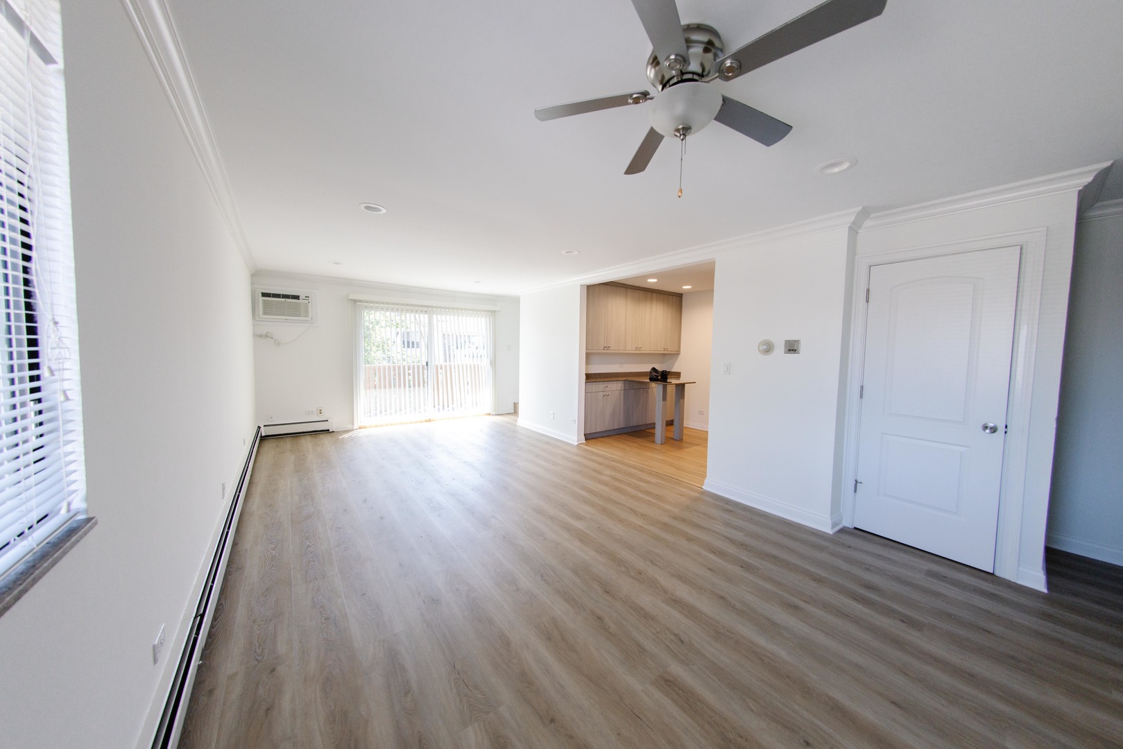 5 Echo Court, Unit 12 Vernon Hills, IL 60061 - Photo 7 of 14 a view of empty room with wooden floor and ceiling fan
