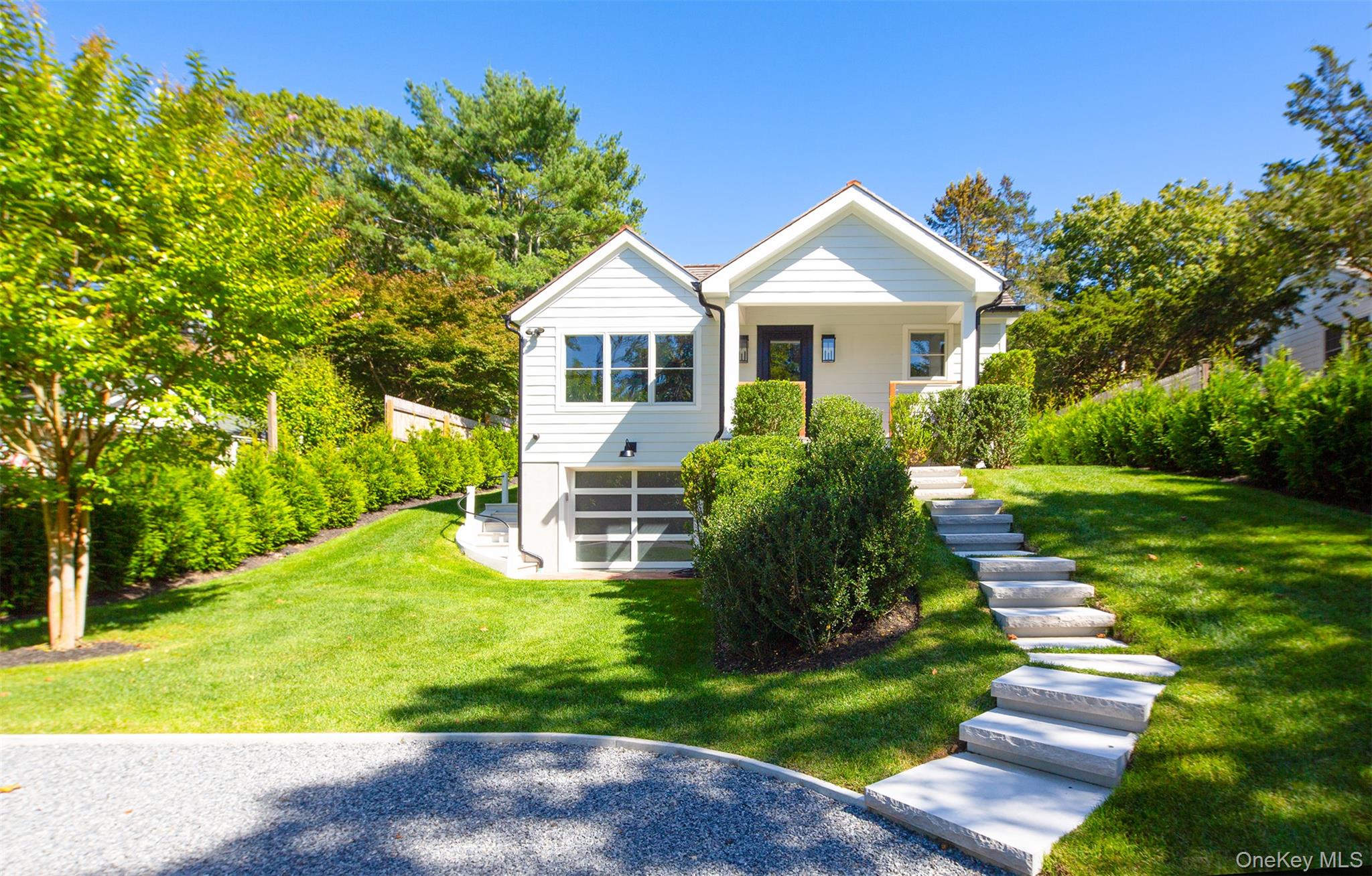 Bungalow with stairway, a front yard, and covered porch