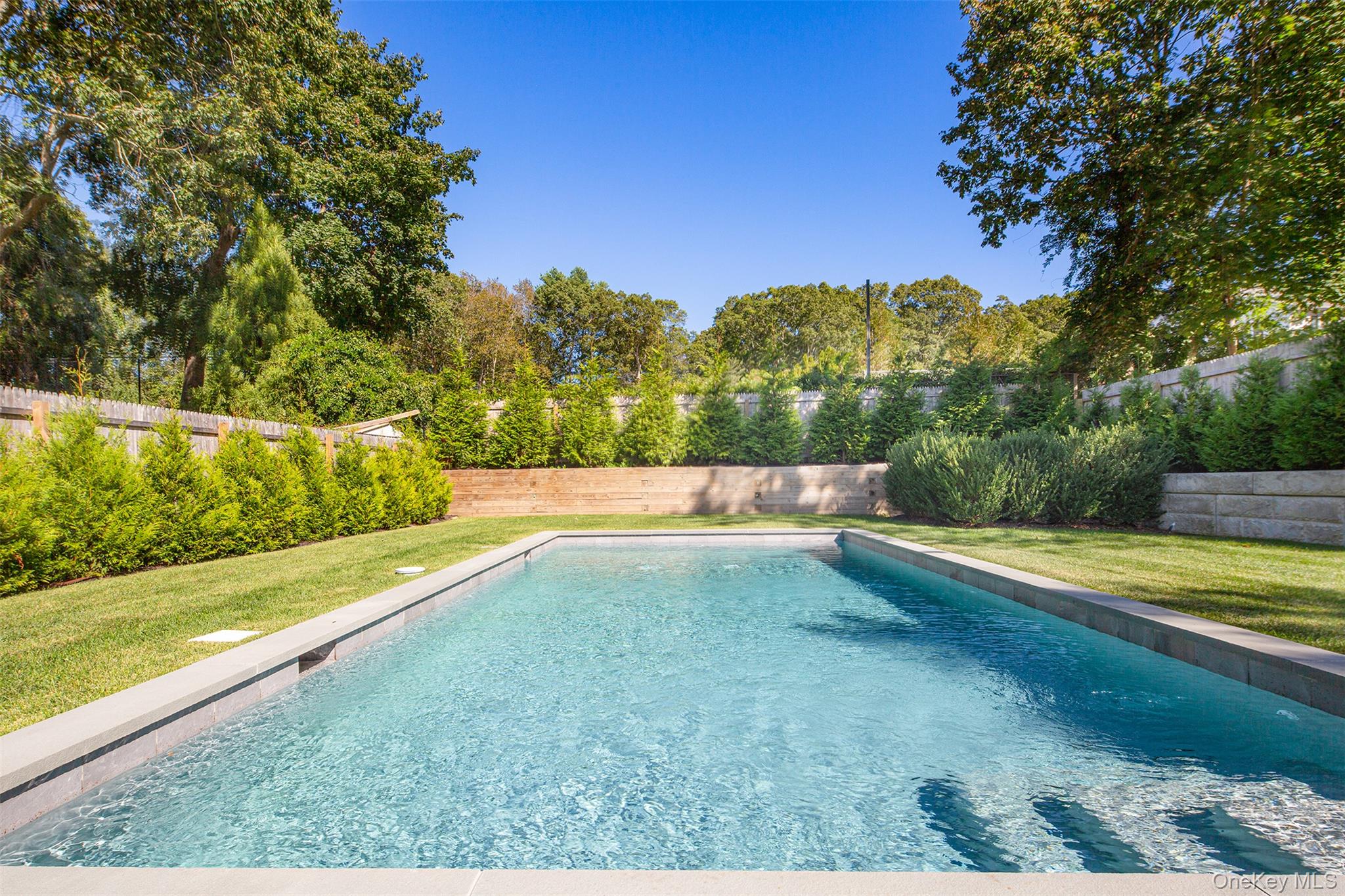 195 Little Fresh Pond Road Southampton, NY 11968 - Photo 37 of 40 View of pool with a fenced backyard and a patio