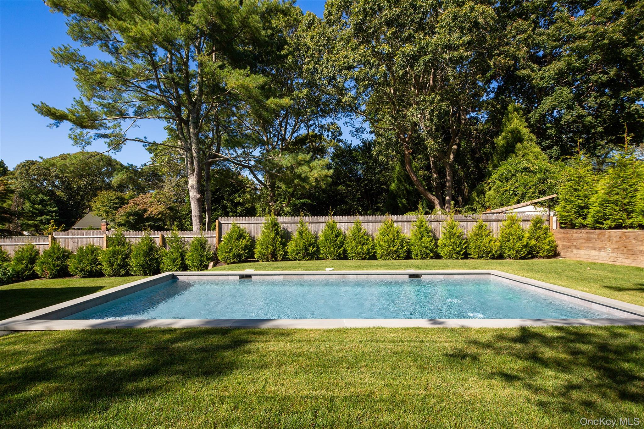 195 Little Fresh Pond Road Southampton, NY 11968 - Photo 38 of 40 View of swimming pool featuring a fenced backyard and a patio area