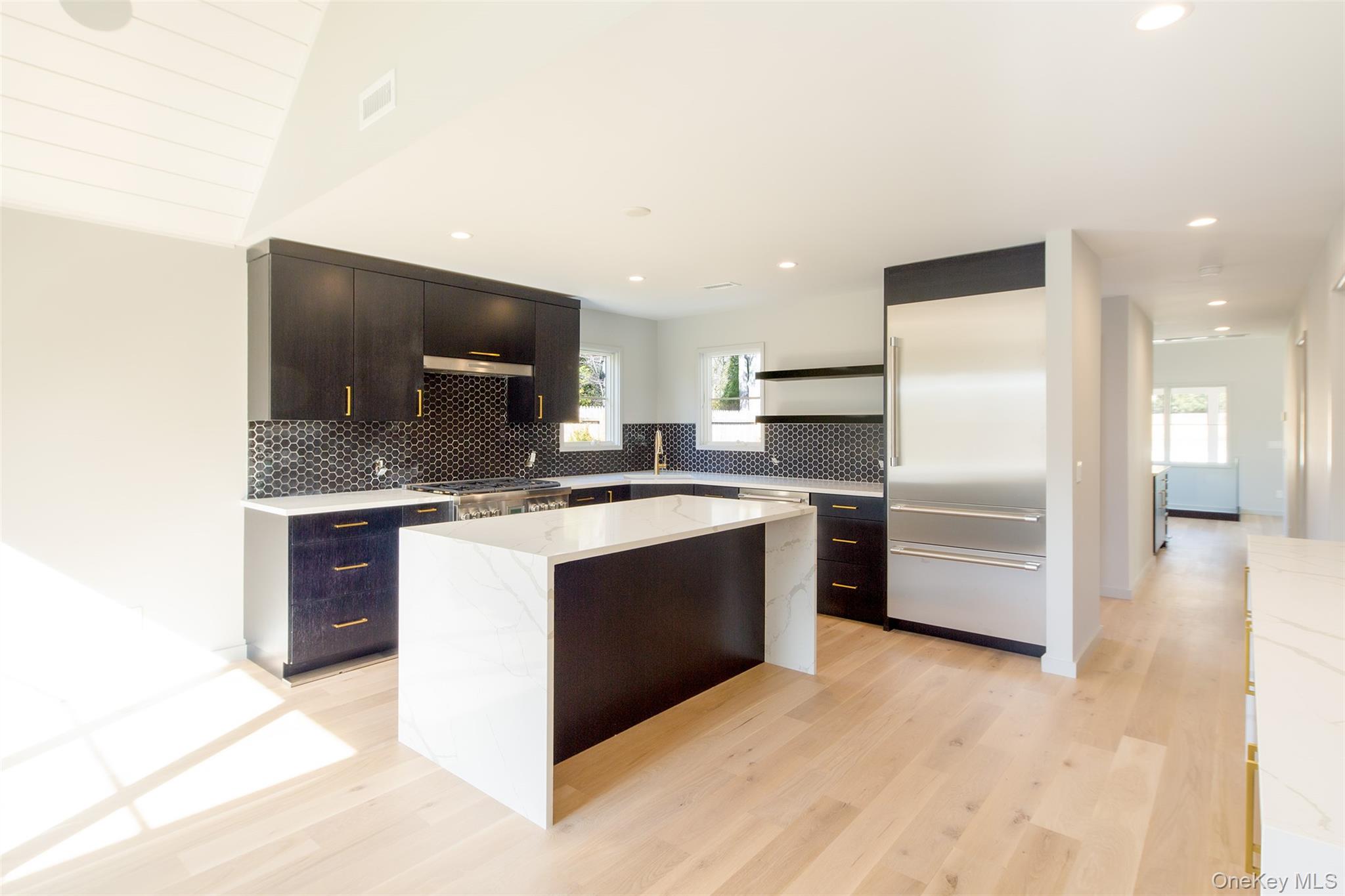 195 Little Fresh Pond Road Southampton, NY 11968 - Photo 4 of 40 Kitchen featuring backsplash, built in refrigerator, a center island, open shelves, and recessed lighting