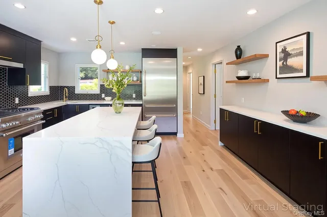 a large kitchen with a table and chairs in it