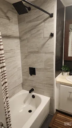 a bathroom with a sink and a shower