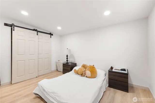 a bedroom with a bed and a dresser