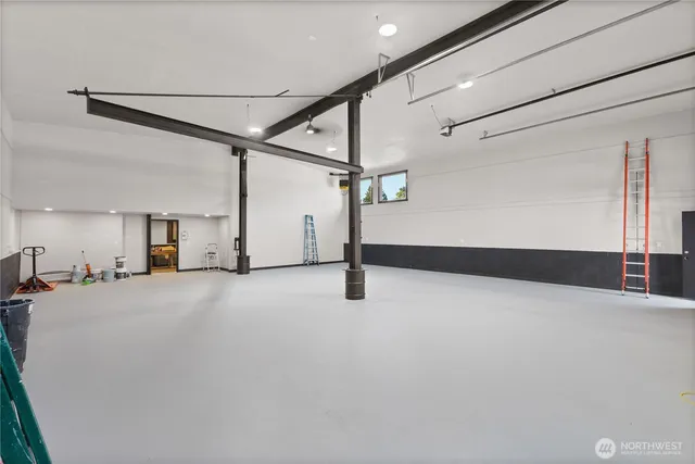 a view of a room with stairs and a ceiling fan