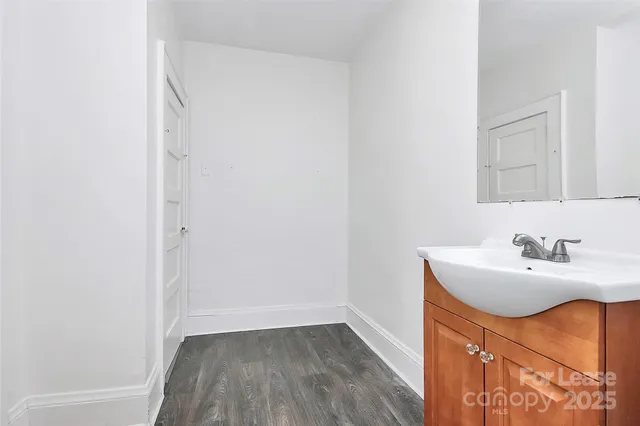 a bathroom with a sink a toilet and vanity