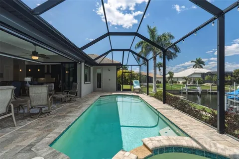 a view of a swimming pool with a patio