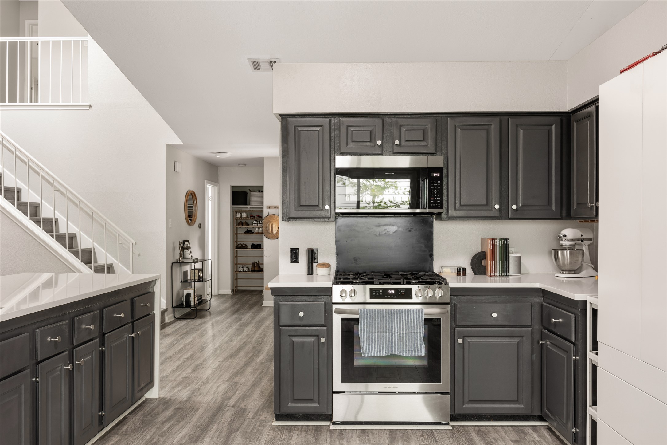 8504 Verona Trail Austin, TX 78749 - Photo 10 of 32 a kitchen with a stove a sink and a microwave