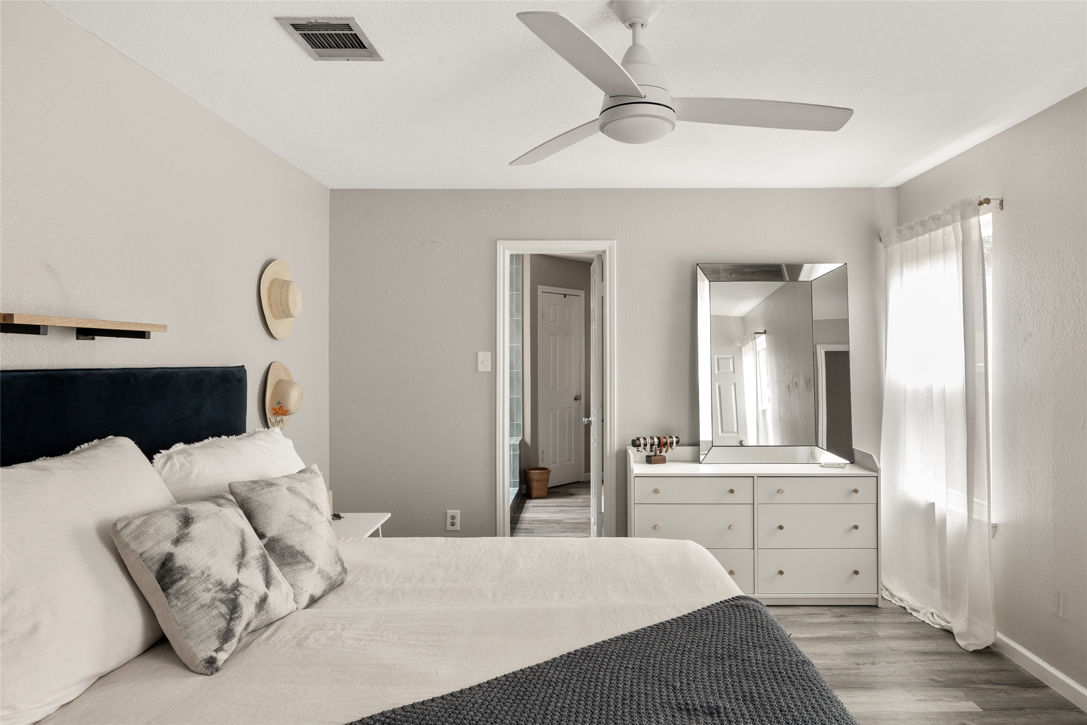 8504 Verona Trail Austin, TX 78749 - Photo 18 of 32 a bedroom with furniture and a large mirror